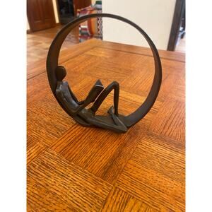 Metal reading man statue